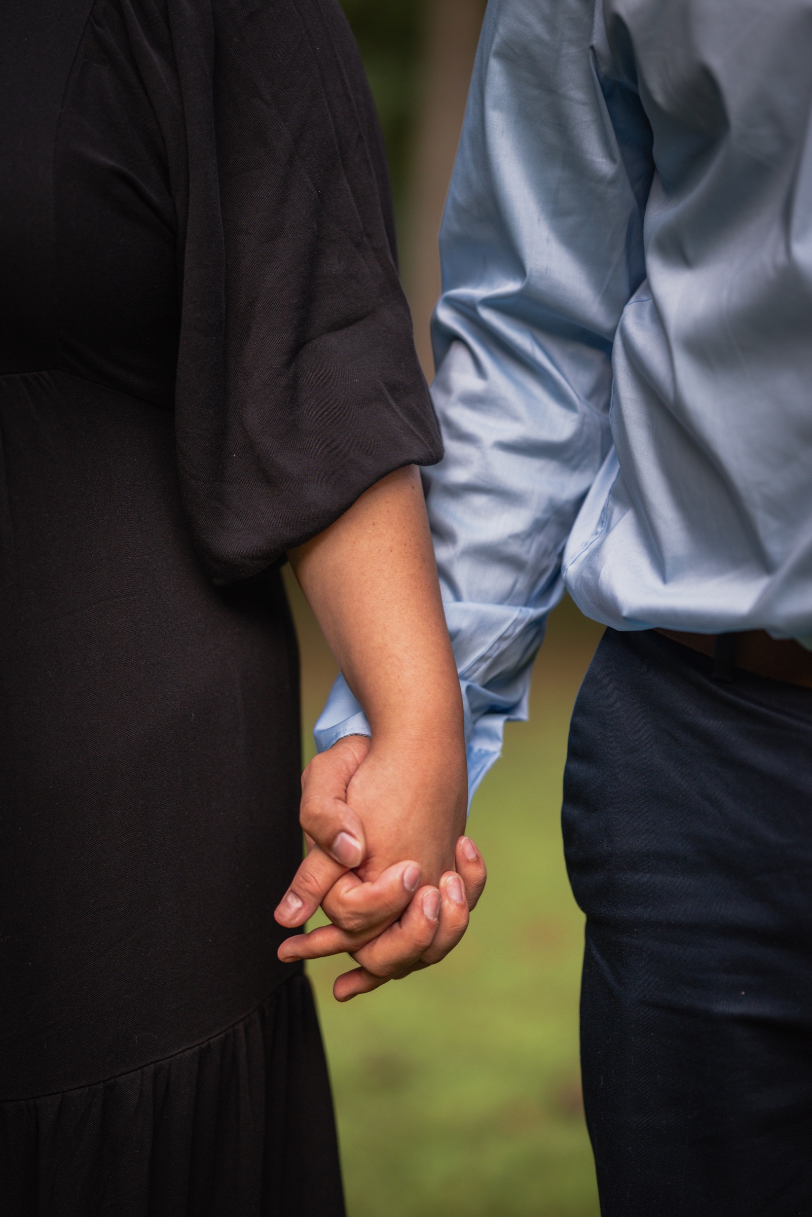 Close portrait of a couple holding hands